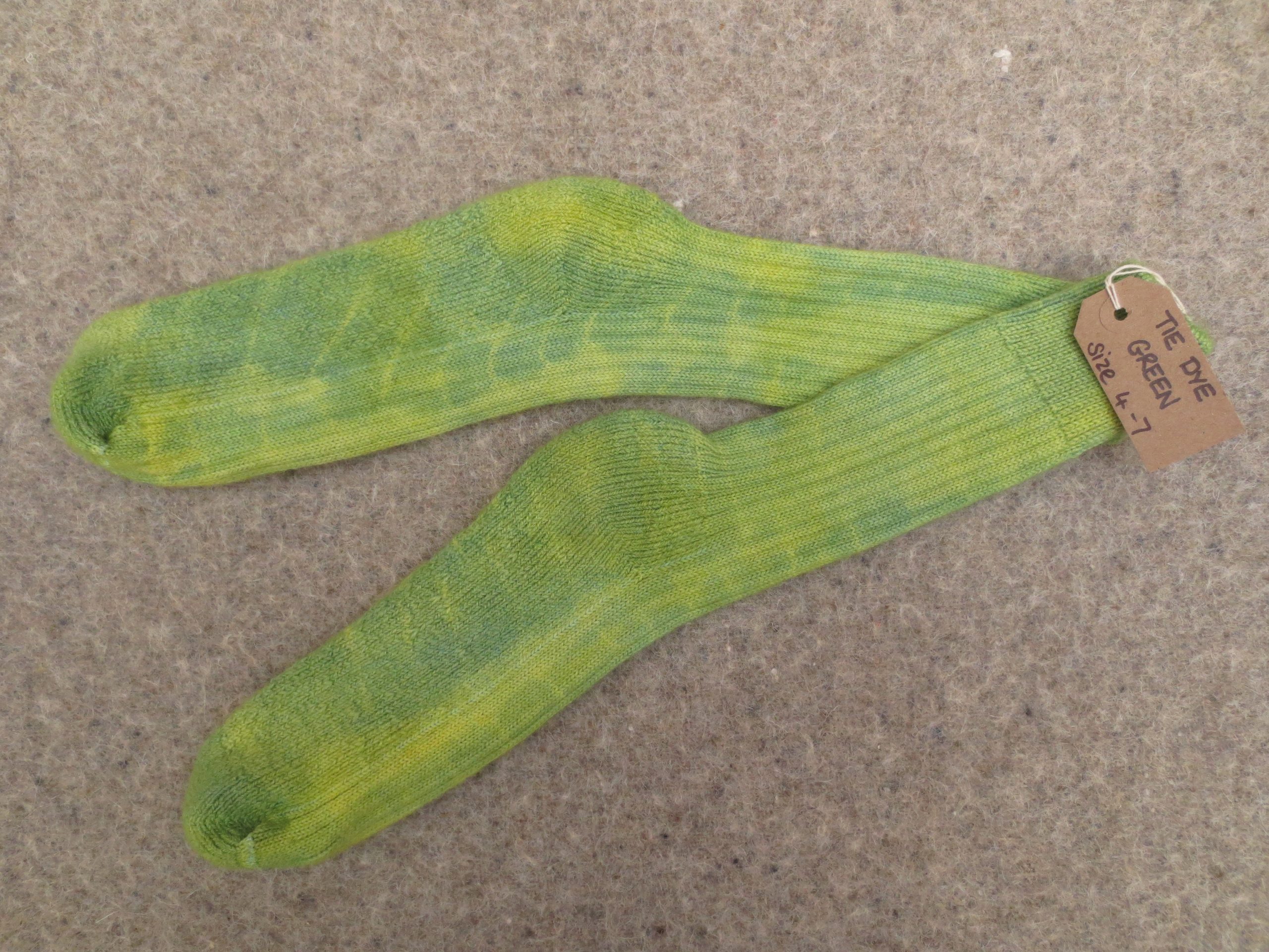 1 Pair of socks labelled tie dye green