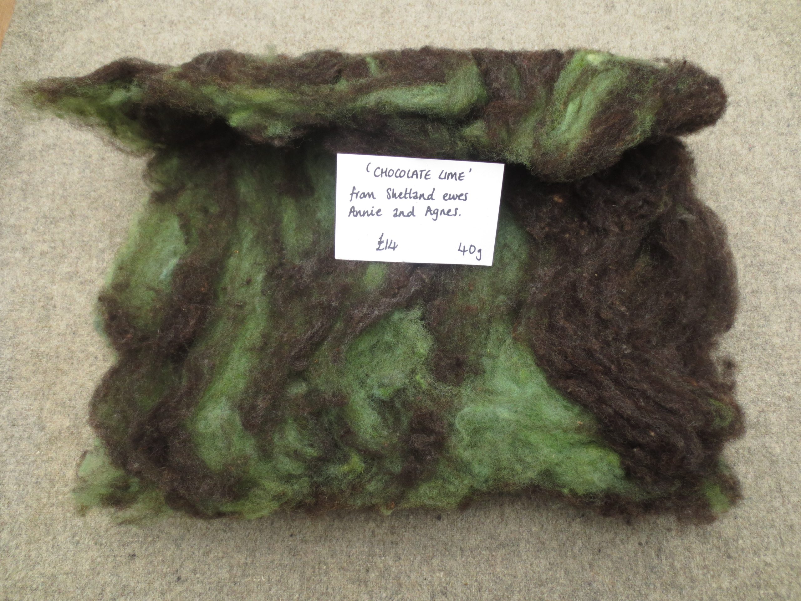 One unrolled batt in green and brown