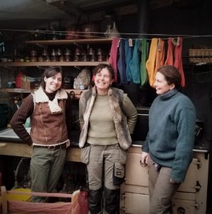 3 outsiders with a background of naturally dyed socks in the workshop 