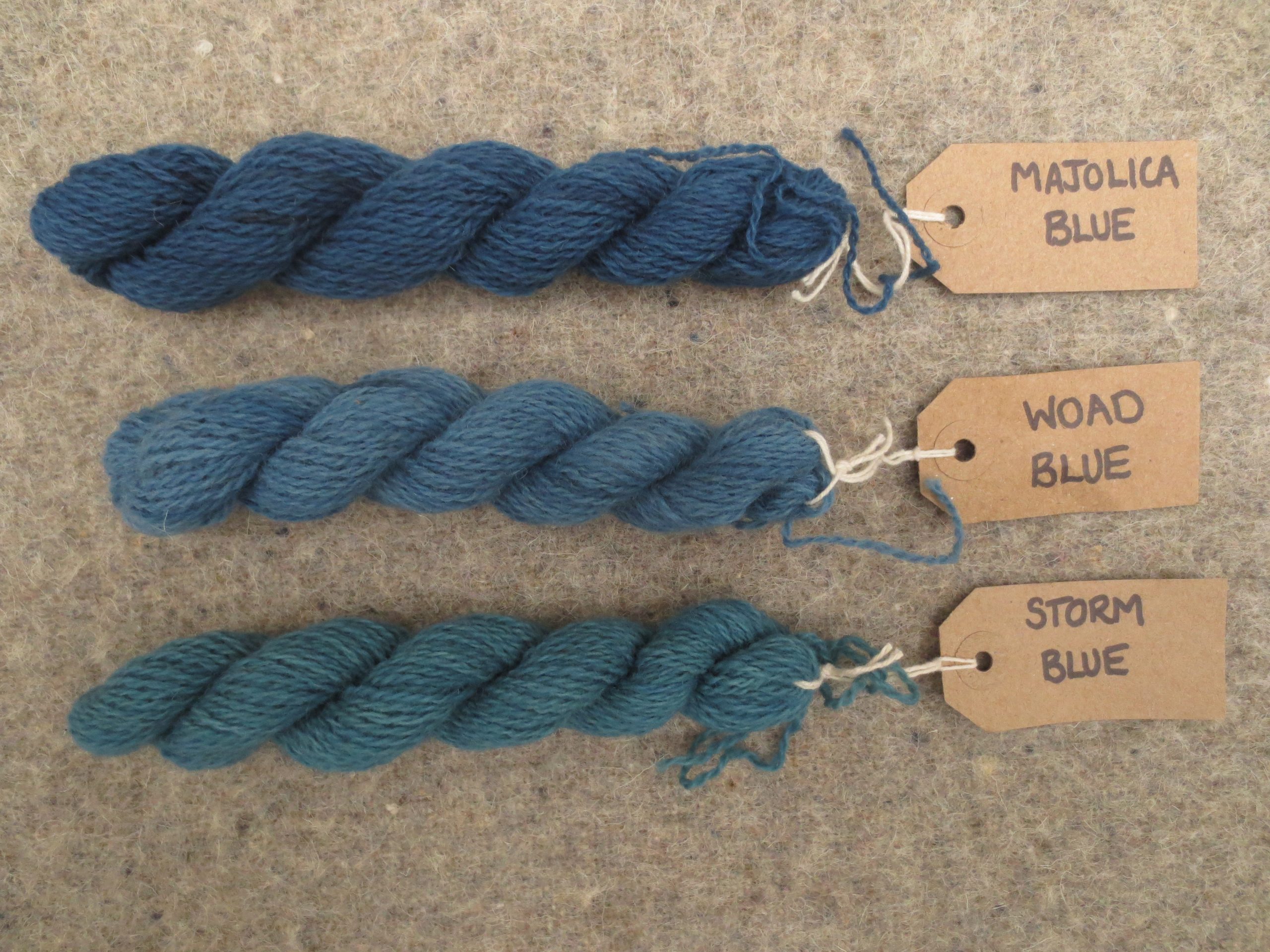 Tablet weaving wools labelled majolica blue, woad blue and storm blue