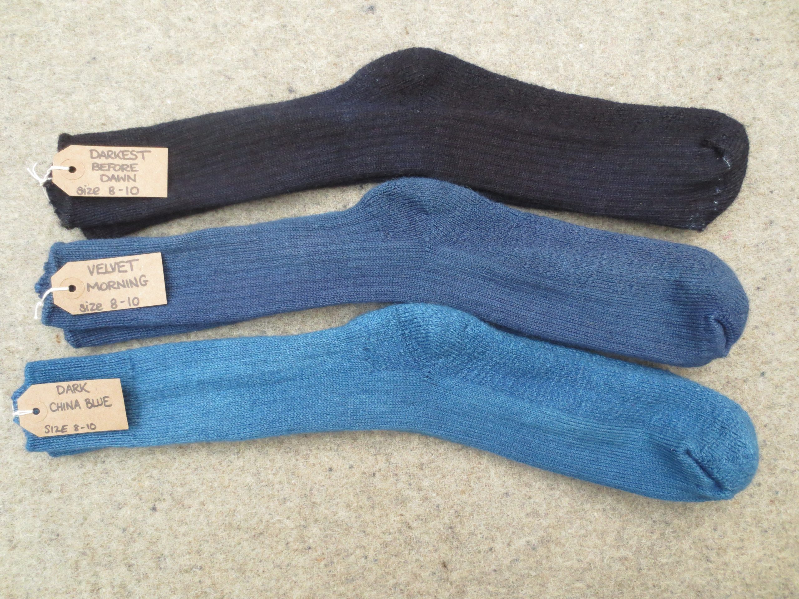 3 pairs of walking socks labelled darkest before dawn, velvet morning and dark china blue