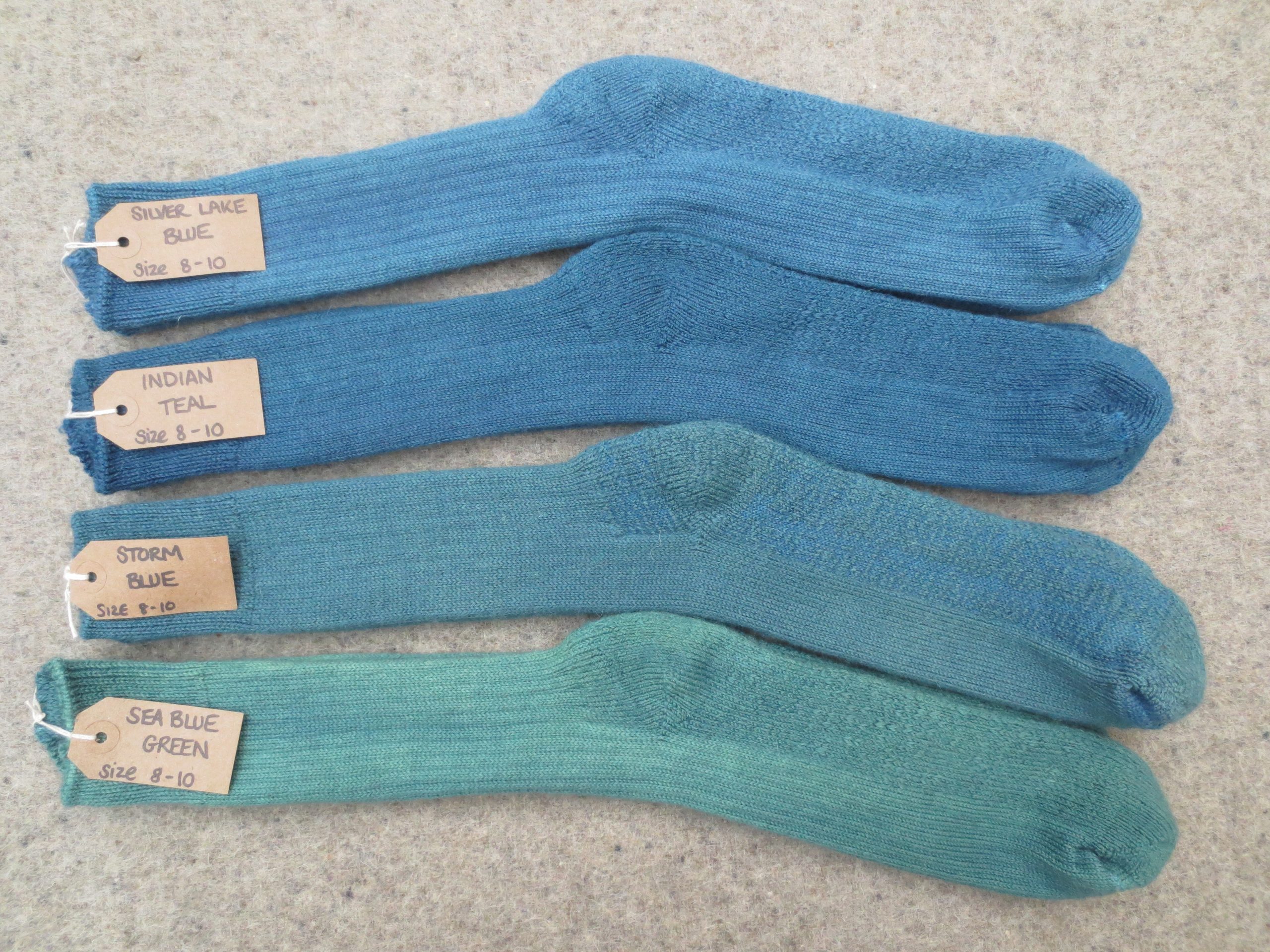 4 pairs of walking socks labelled Silver Lake Blue, Indian Teal, Storm Blue and Sea Blue Green