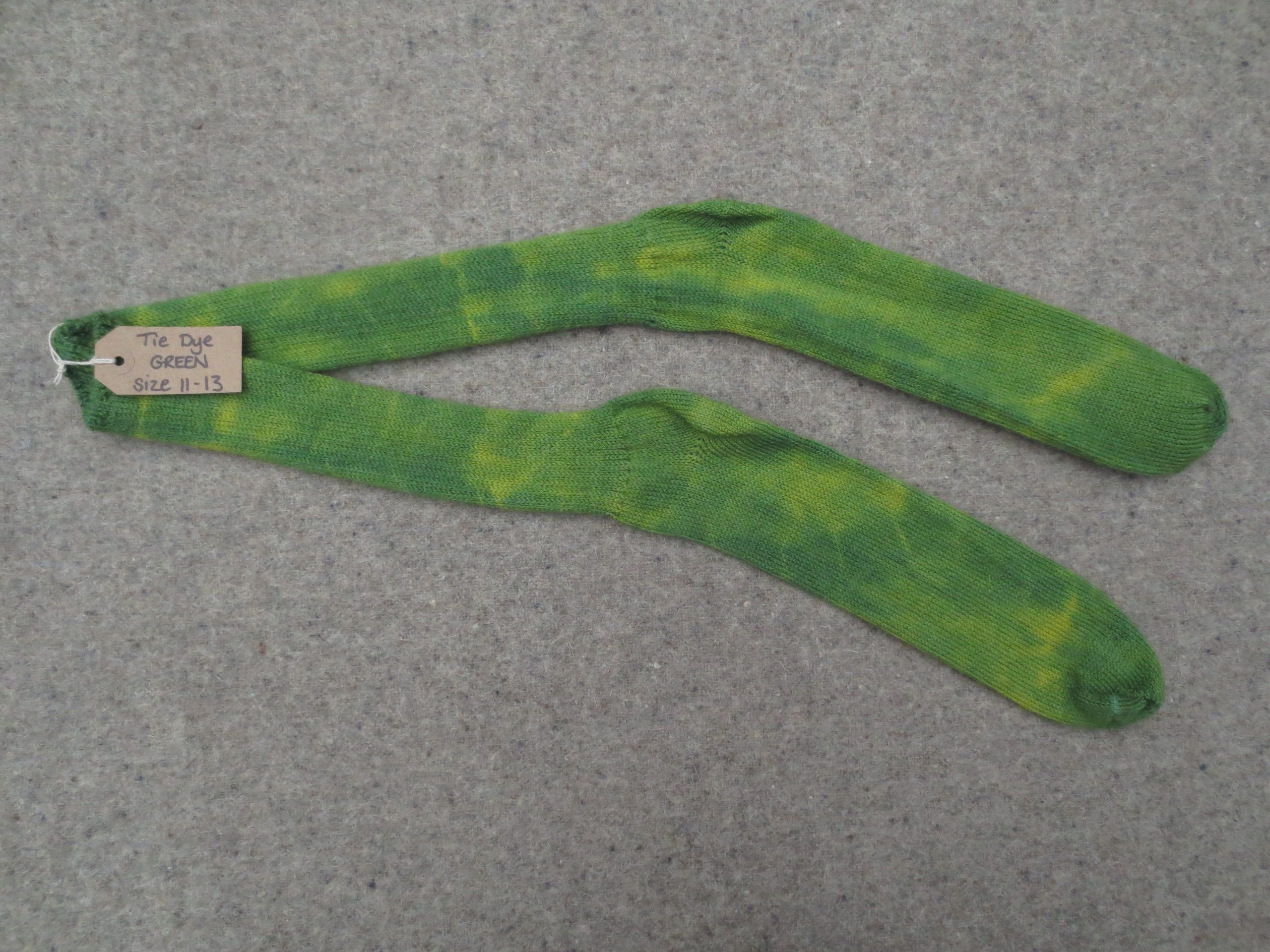 One pair of socks labelled Tie Dye Green