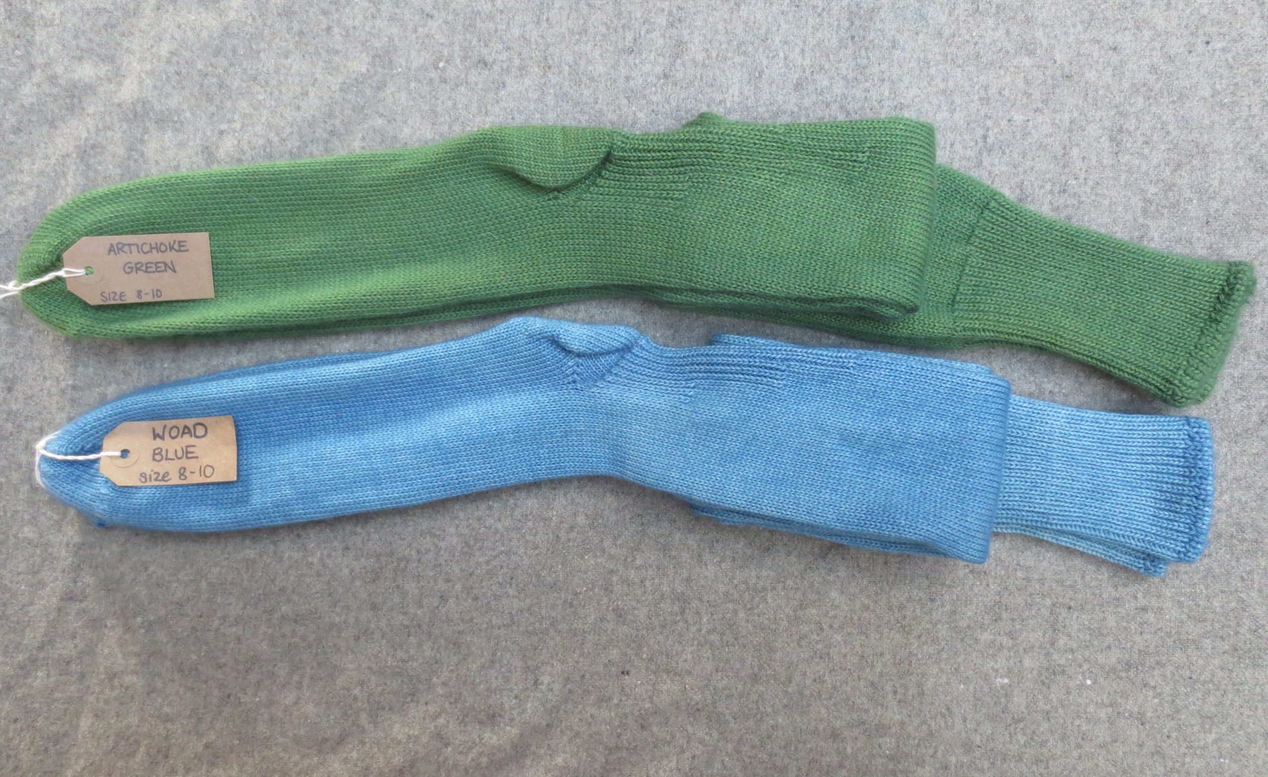 2 pairs of welly boot socks labelled Artichoke Green and Woad Blue