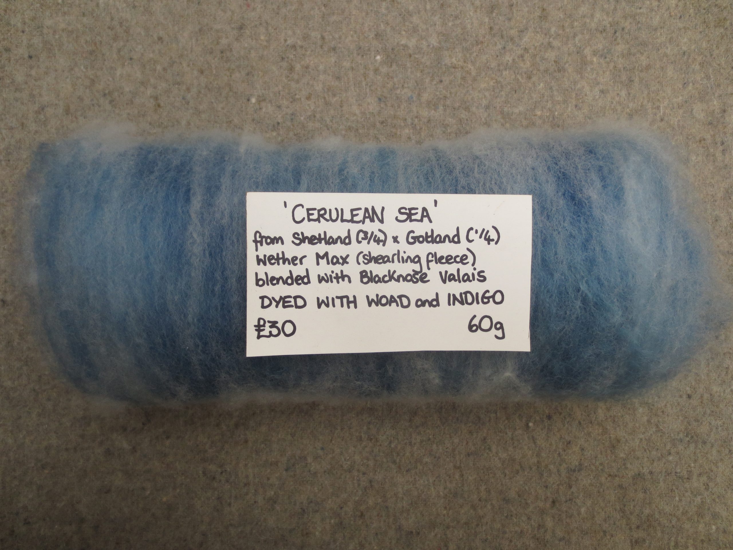 rolled batt labelled with price and dyes