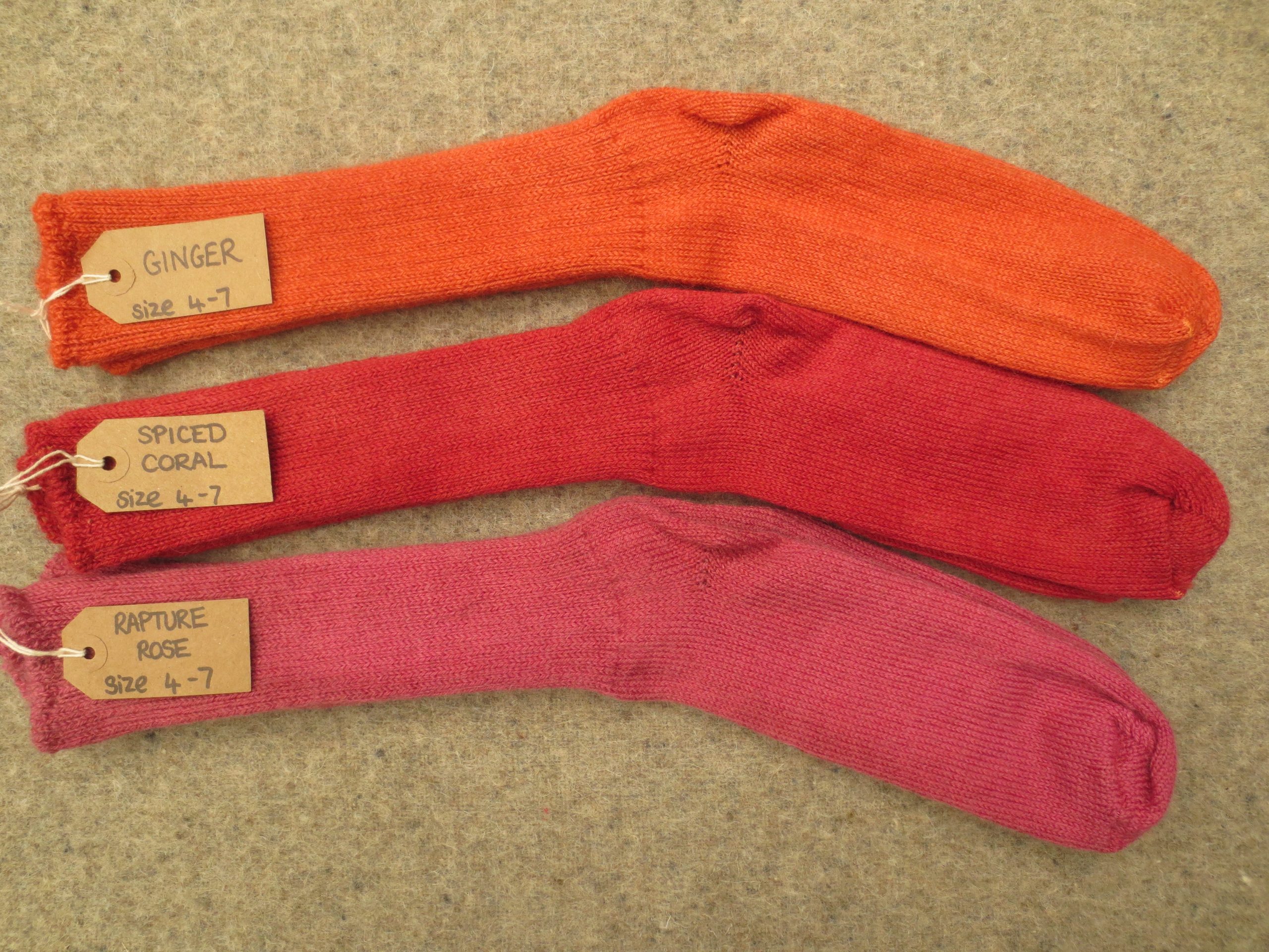 3 pairs of socks labelled Ginger, Spiced Coral and Rapture Rose