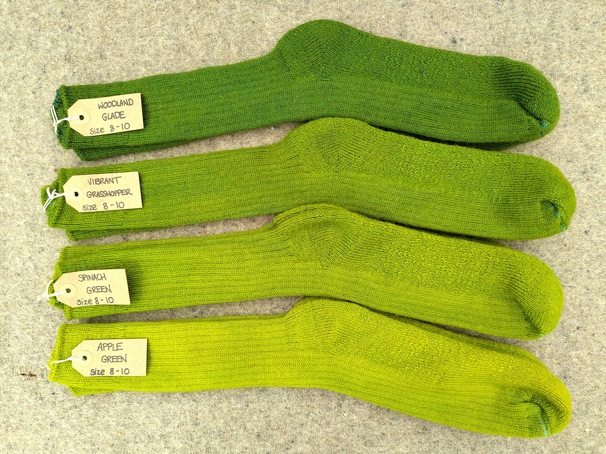 5 pairs of socks labelled woodland Glade, vibrant grasshopper, spinach green and apple green